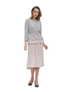 Jersey tunic with raglan sleeves and silk trim. The tunic is gathered at the waist with a ribbon.