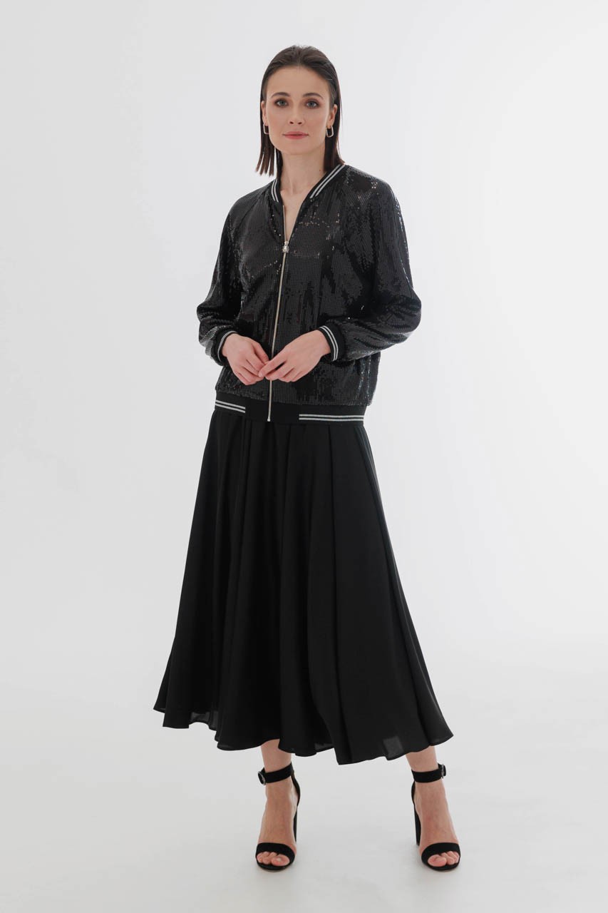 A flying, flowing satin skirt can be combined with a basic T-shirt or top, as well as a more complex top.