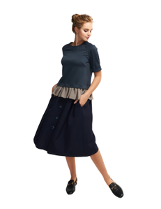 gathered skirt with a side seam pockets. Decorative strip trimmed with buttons on the front.