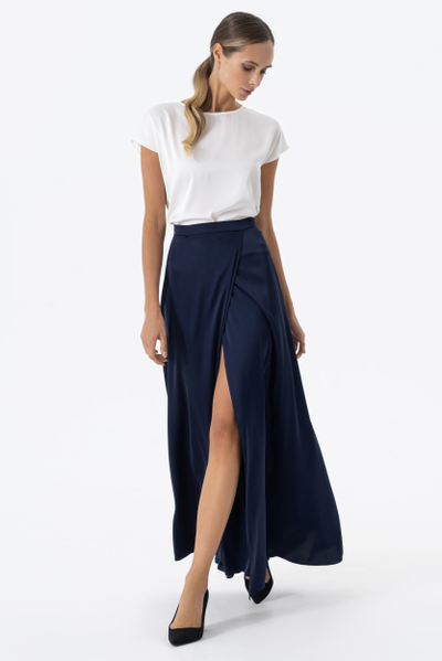 Floor-length flowing satin skirt with false asymmetrical wrap at the front and invisible zip at the back.