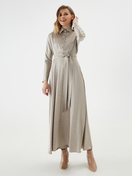 A flowing satin dress with a one-piece sleeve, a fold-over collar and a placket with glossy buttons on the leg. The cutting line is decorated with tucks. The dress comes with a detachable belt.
