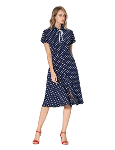 Stylish and romantic fitted dress in blue crepe with a pattern of white polka dots. Turn-down shirt collar with white rep ribbon trim and fastener for sewing buttons on the placket. One-piece flat deflated sleeve.