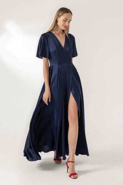 Evening maxi wrap dress, with butterfly sleeves and floating skirt with a decorative plank trim on the split.