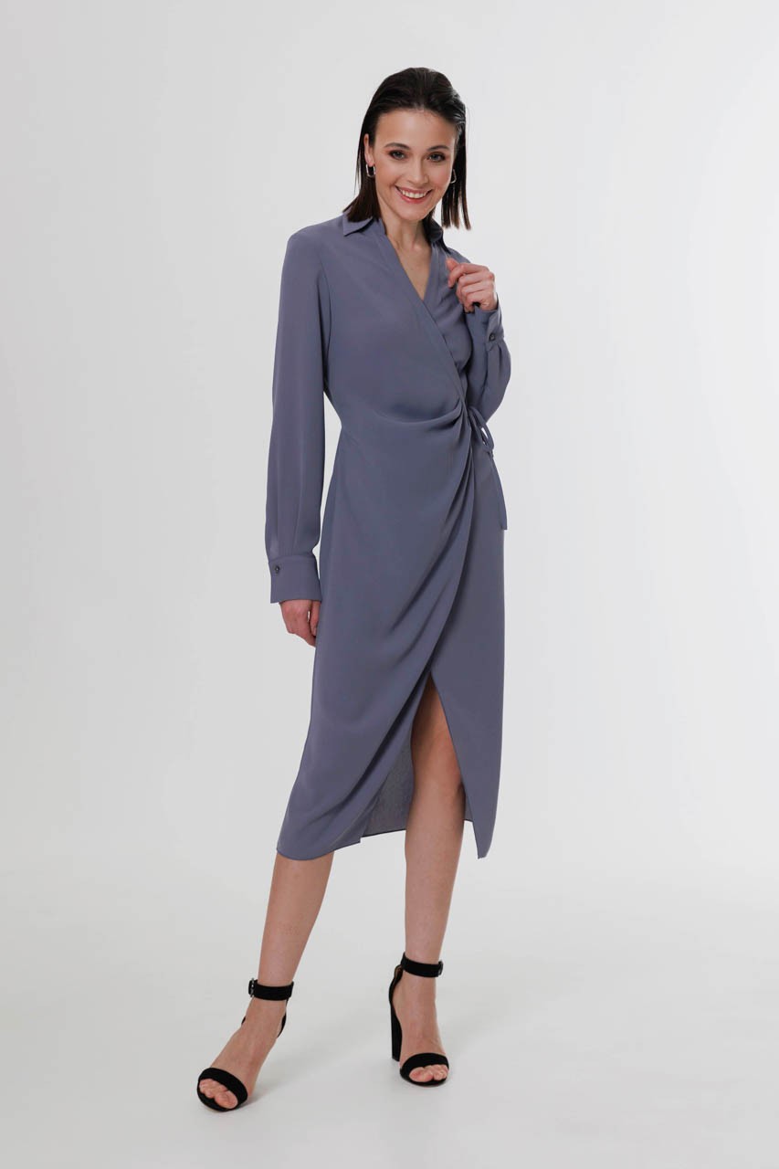 Soft crepe dress with a ribbon strap fastening on the side and a cuffed sleeve. Asymmetrical drappery and beautiful neckline create feminine silhoutte