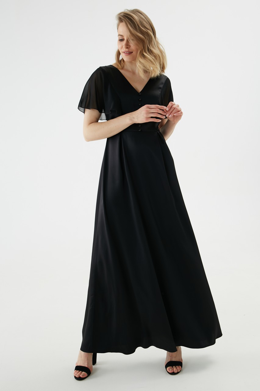 Satin cadi dress with light silk chiffon wing sleeves. A sophisticated, minimal silhouette, a slit and glossy ball buttons on the front create a subtle evening look.