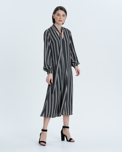 Elegant urban dress with a straight silhouette with a geometric pattern. Elegant neckline, ribbon decor and gathered sleeve at the cuff. Suitable for both the office and evening out.