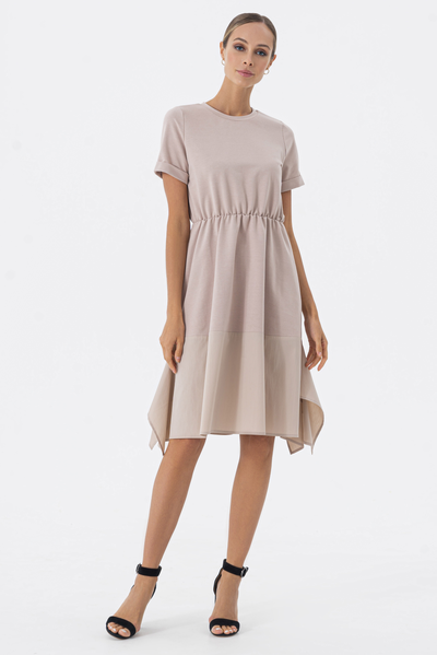 Comfortable dress made of a combination of fabrics — a plastic top and a cotton bottom element with molded tails.