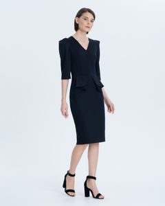 An exquisite business dress made of premium Italian wool with a thin viscose lining. Fastens on the back with a metal zipper. Trim with symmetrical basque ruffles, longitudinal neckline, elbow sleeves and fitted silhouette.