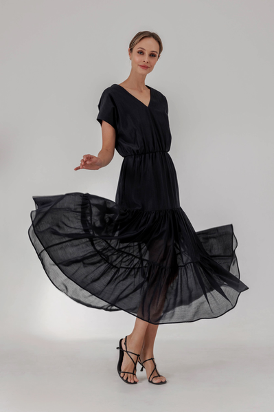 Flowy dress with gathered panels and elasticated waistline, flared sleeves and neat V-neckline.