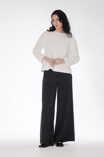 Comfortable chic — flowy satin trousers in a free, flying silhouette with two tucks and pockets at the waist. Trousers can m…