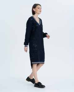 Dress made of premium wool Jersey with openwork texture. The longitudinal triangular neckline, the bottom of the sleeves and…