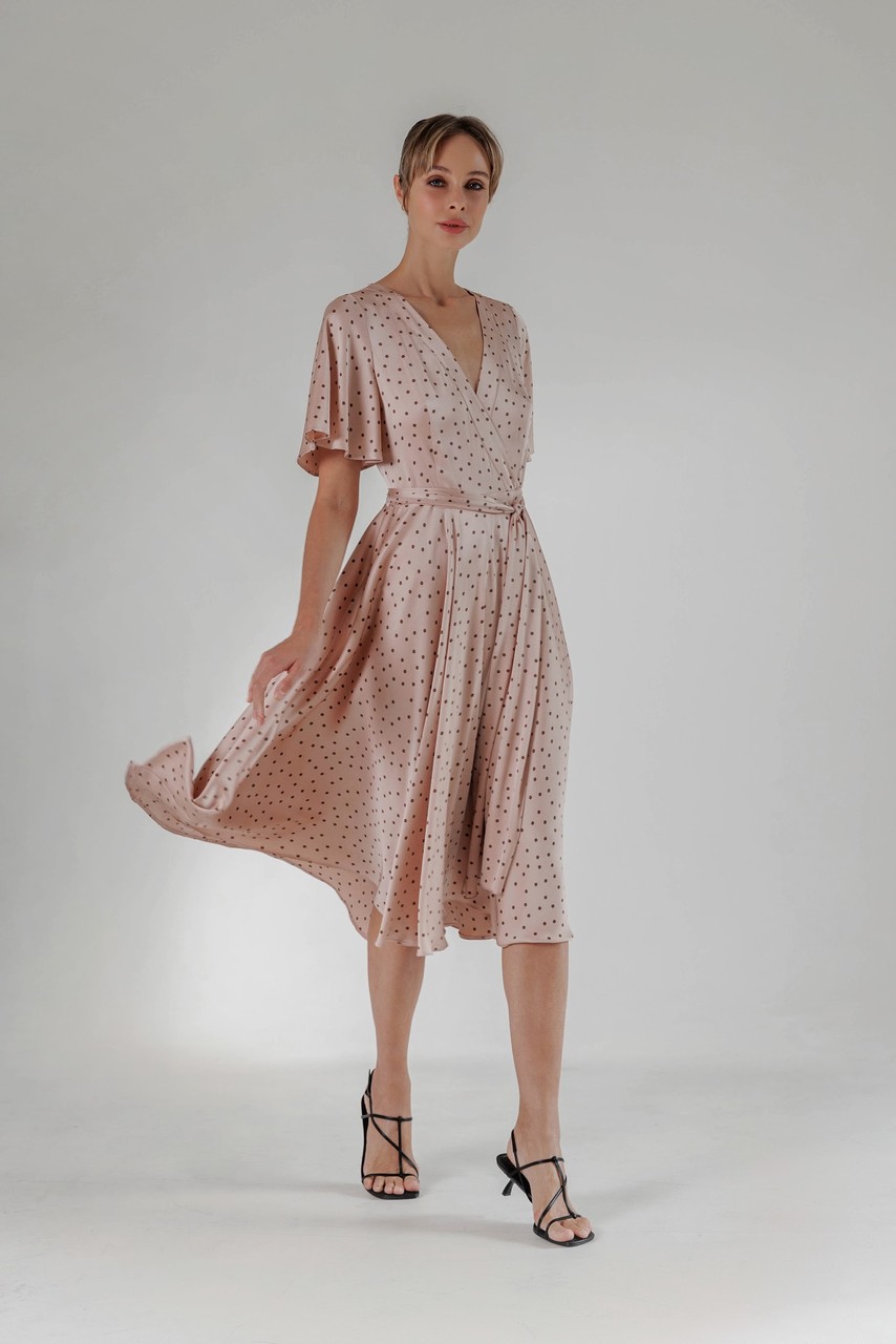 Flowy dress with gathered panels and elasticated waistline, flared sleeves and neat V-neckline.