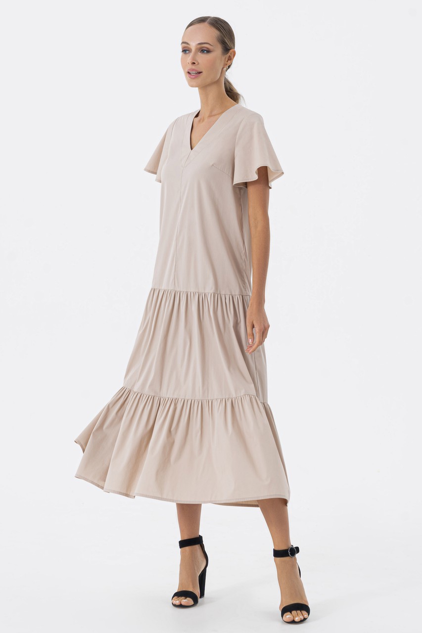 Flying dress with gathered bumpers, flying sleeves and a neat longitudinal neckline