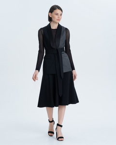 Flared skirt made of thin suit wool. It will add femininity to your everyday business image.