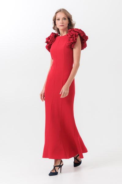 An evening silhouette dress to the floor with a small V-neck on the back. The dress is decorated with puffy decorative taffeta sleeves.