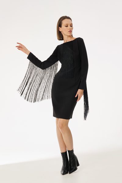 A silhouette dress with beautiful constructive lines and a shallow cutout on the back7 The dress is trimmed with a flowing fringe that creates a light and flying look.