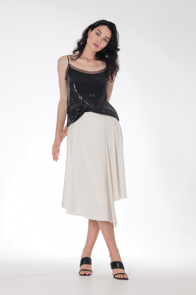 An asymmetric flowing satin skirt on the belt fastens with a hidden zipper.