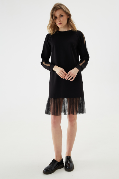 Minimalistic and comfortable dress made of thick jersey with stripe and frill made of openwork mesh.