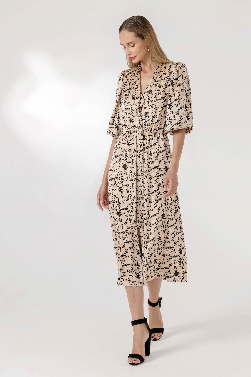 Light printed satin dress with beautiful ribbons on the neck and a gathering on the waist for a more feminine silhoutte. Elbow bishop sleeves with elasticated gathered cuff.